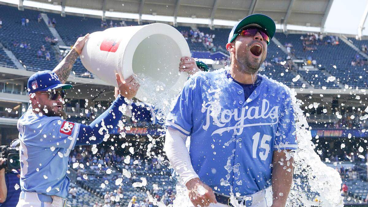 Kansas City Royals right fielder Randal Grichuk (15) is doused by center fielder Kyle Isbel (28) after the win over the Cleveland Guardians at Kauffman Stadium on Sunday in Kansas City.