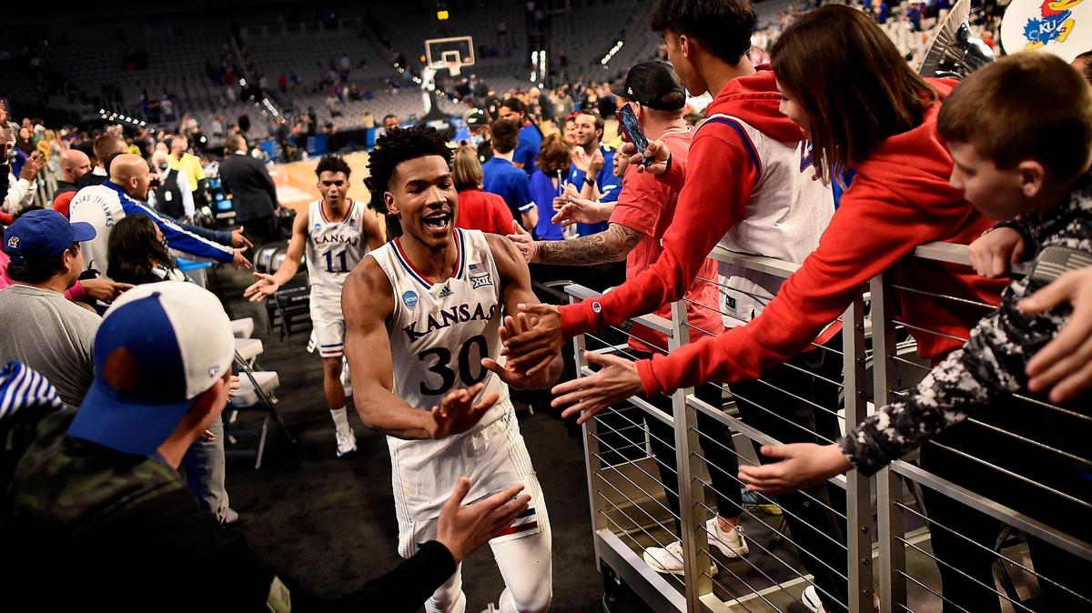 KU’s Ochai Agbaji and teammate Remy Martin breathed a sigh of relief and were greeted by Jayhawks fans after beating Creighton 79-72 in a second-round NCAA Tournament game Saturday in Fort Worth, Texas.