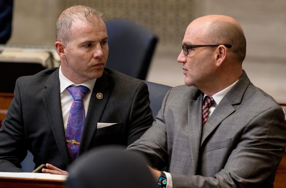 Sen. Rick Brattin, a Harrisonville Republican, left, speaks with Sen. Denny Hoskins, a Warrensburg Republican, during session on Wednesday, Feb. 21, 2024, in Jefferson City.