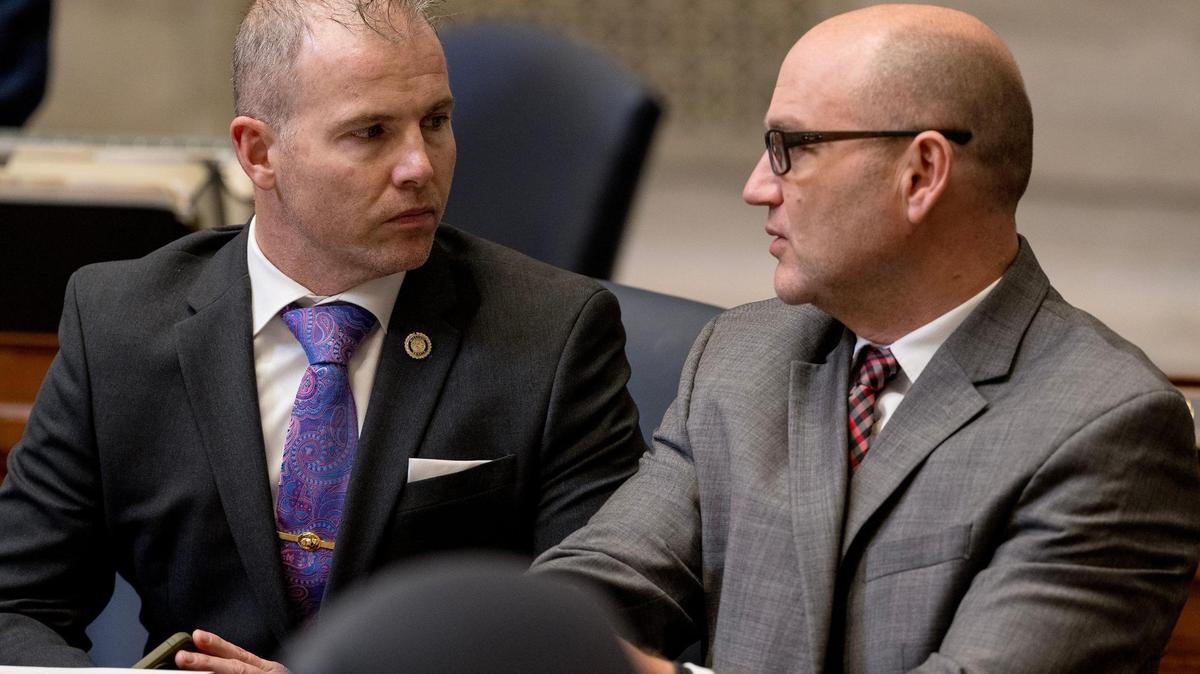 Sen. Rick Brattin, a Harrisonville Republican, left, speaks with Sen. Denny Hoskins, a Warrensburg Republican, during session on Feb. 21 in Jefferson City.