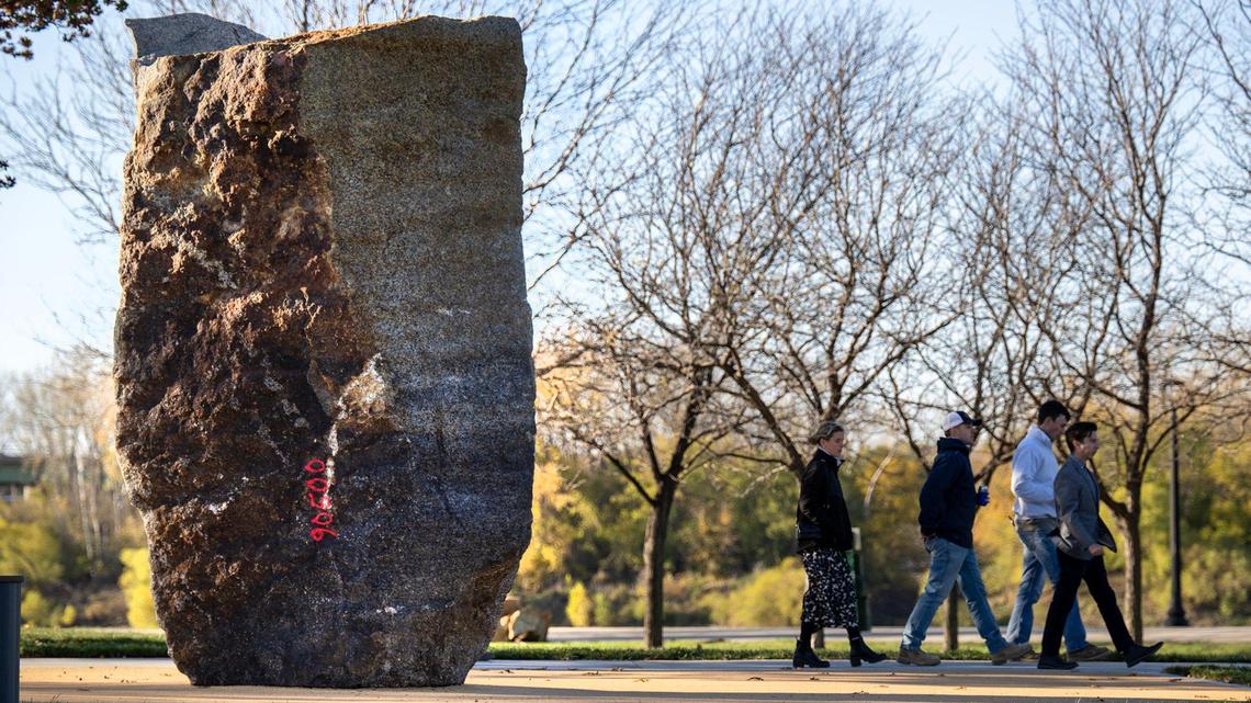 A 38,000-pound granite boulder serves as the centerpiece of Riverfront Boulder @ Berkley, a new urban bouldering park where officials held a ribbon cutting Wednesday at the Berkley Riverfront in Kansas City. Plans call for the park to open on Thursday.