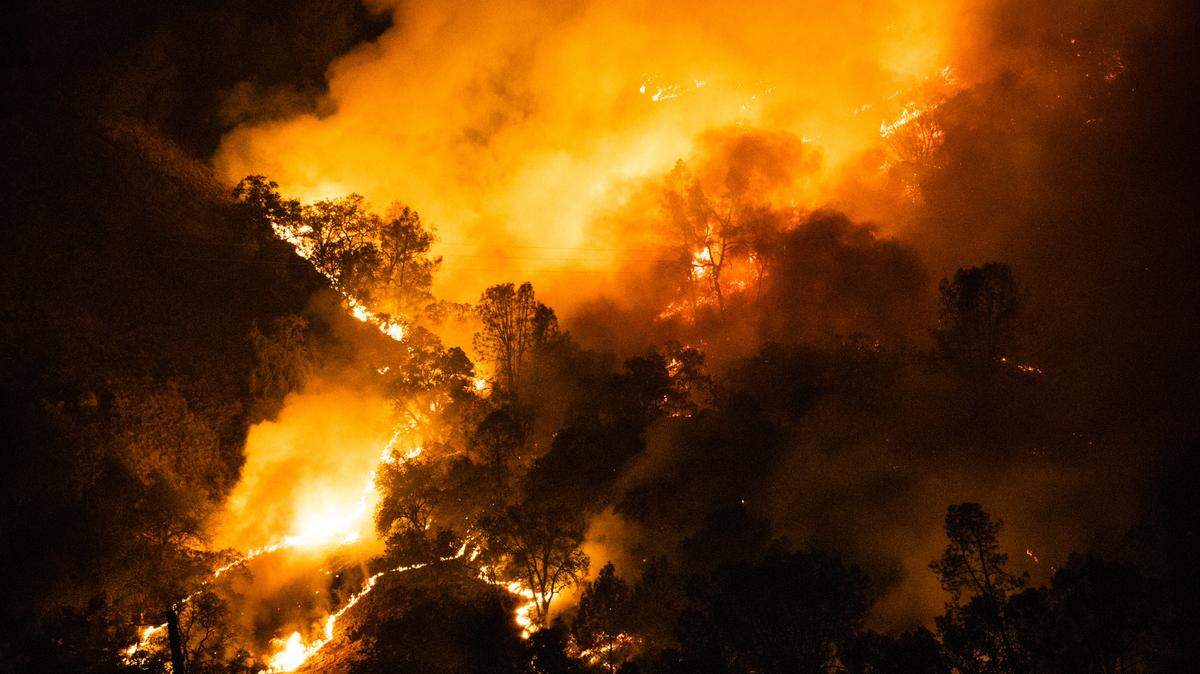 The Glass Fire burns above Calistoga, Calif., early Tuesday, Sept. 29, 2020. Wildfires continued to rage across California on Tuesday, forcing tens of thousands of residents to evacuate their homes.