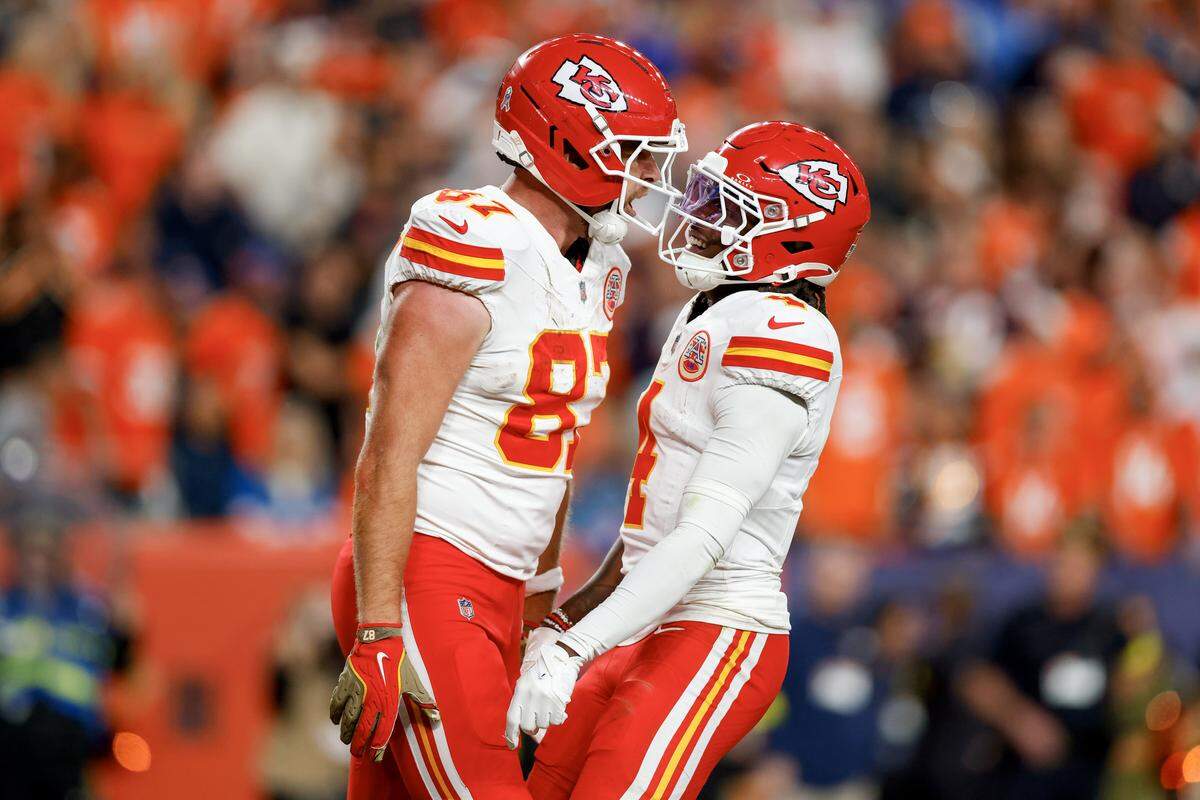 Kansas City Chiefs tight end Travis Kelce, left, celebrates his touchdown catch with teammate Rashee Rice during an NFL Week 11 game against the Broncos at Empower Field At Mile High in Denver on Sunday, Nov. 16, 2025.