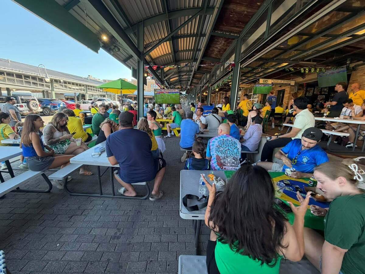 Soccer fans pack Taste of Brazil in the River Market to watch a World Cup match. Owner Marco Rabello said the tournament has led to a surge in customers for the authentic Brazilian restaurant.