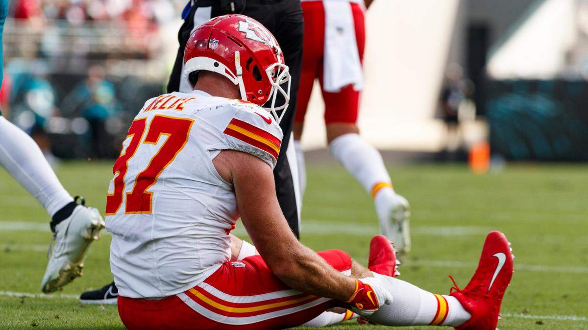 Kansas City Chiefs tight end Travis Kelce (87) sits after a play against Jacksonville Jaguars during the fourth quarter at EverBank Stadium.