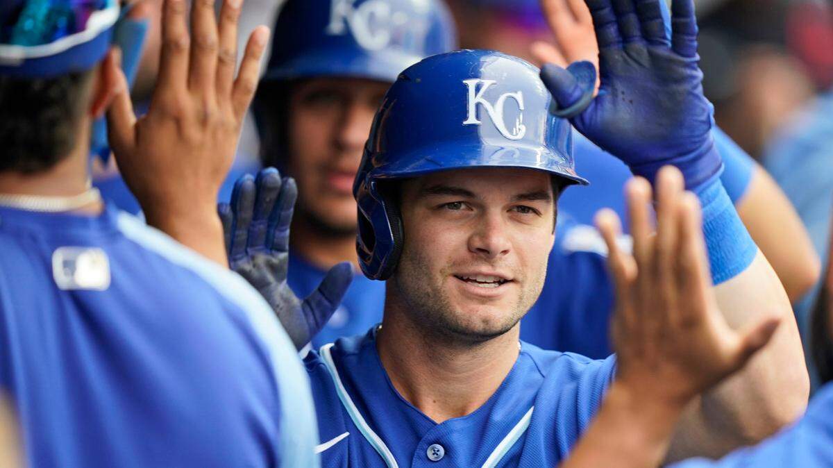 Kansas City Royals’ Andrew Benintendi celebrates with teammates after hitting a two-run home run in the third inning in the first baseball game of a doubleheader against the Cleveland Indians, Monday, Sept. 20, 2021, in Cleveland. (AP Photo/Tony Dejak)