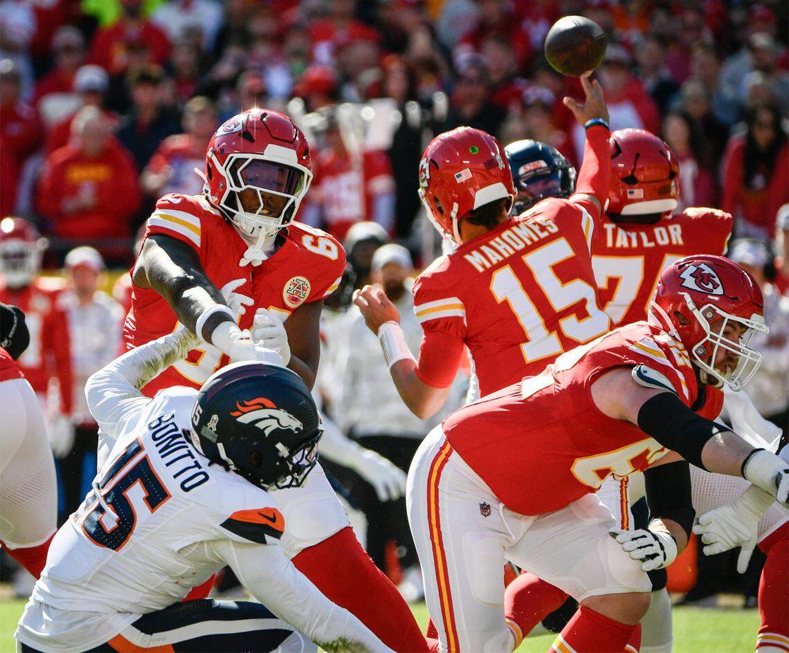 Kansas City Chiefs offensive tackle Wanya Morris (64) fends off Denver Broncos linebacker Nik Bonitto (15) on Sunday, Nov. 10, 2024, at GEHA Field at Arrowhead Stadium.
