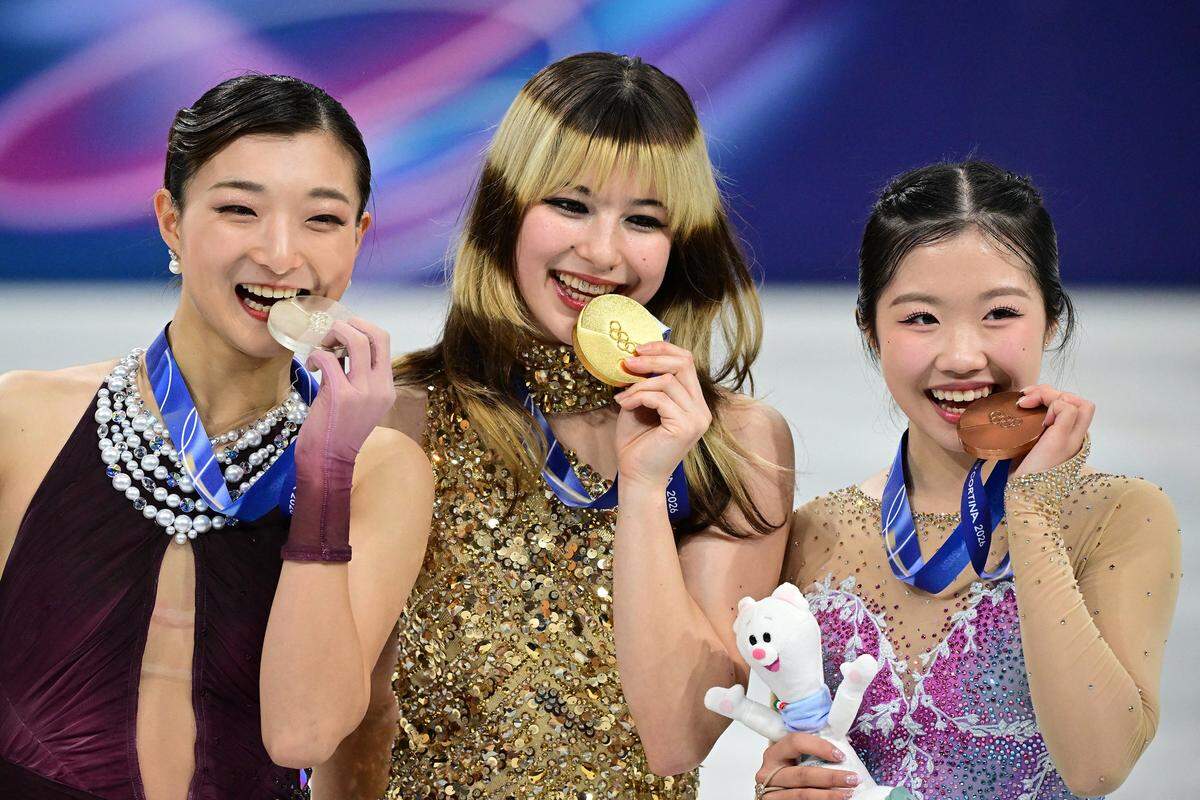 Left to right, silver medalist Japan's Kaori Sakamoto, gold medalist USA's Alysa Liu and bronze medalist Japan's Ami Nakai at the Milano Cortina 2026 Winter Olympic Games in Italy.