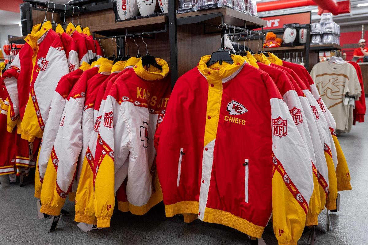 Puffer jackets are displayed on clothing racks at the Kansas City Chiefs Official Pro Shop at Arrowhead Stadium on Wednesday, Jan. 15, 2025, in Kansas City.