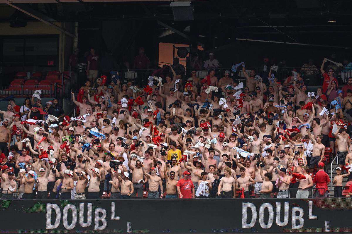 Shirtless fans cheer on the home team during the host Cardinals’ 4-2 win against the Royals at Busch Stadium in St. Louis on Saturday, May 16, 2026.