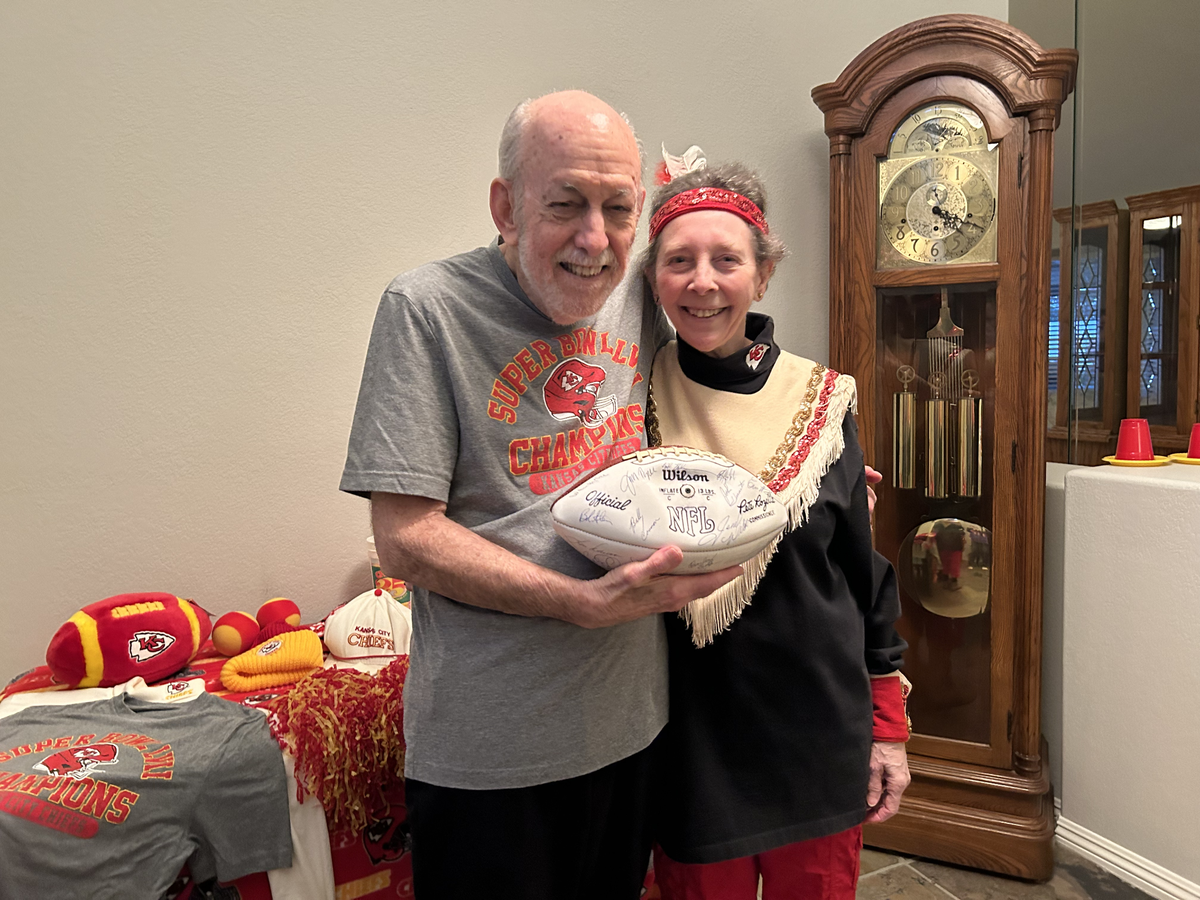 Alongside Marshall Movitz, her husband of over 45 years, Caren Goldberg Movitz poses in her original Chiefettes costume.