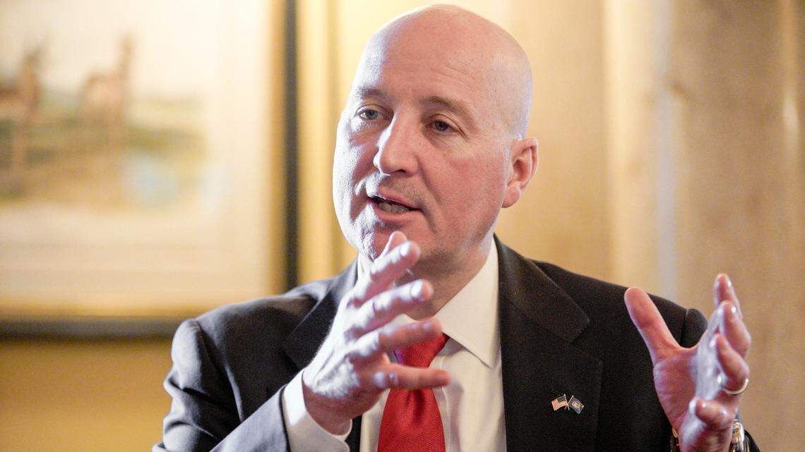 In this Jan. 3, 2019 photo, Gov. Pete Ricketts speaks during an interview in his office in Lincoln, Neb. Ricketts is preparing to start his second and final term in office next week with a focus on jobs, lowering taxes and promoting Nebraska domestically and abroad. (AP Photo/Nati Harnik)