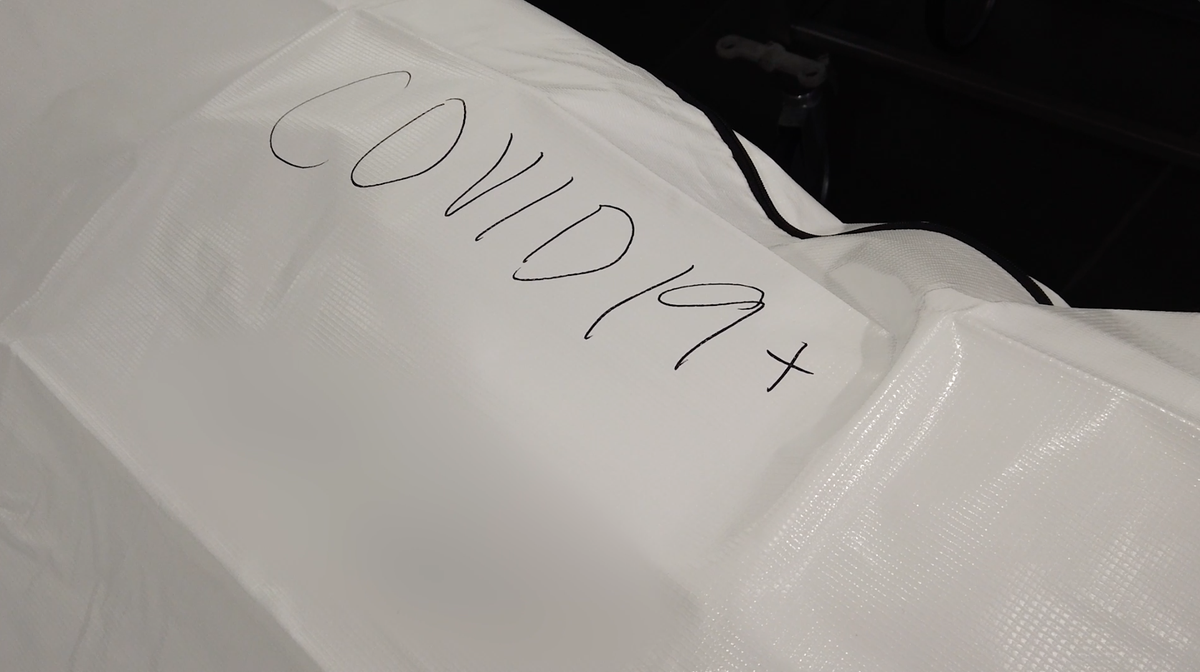 At the University of Kansas Health Systems, “COVID-19+” is written in large letters on the bags of patients who died from the disease so that whoever takes the bodies to the funeral home or crematory is aware and knows to take precautions.