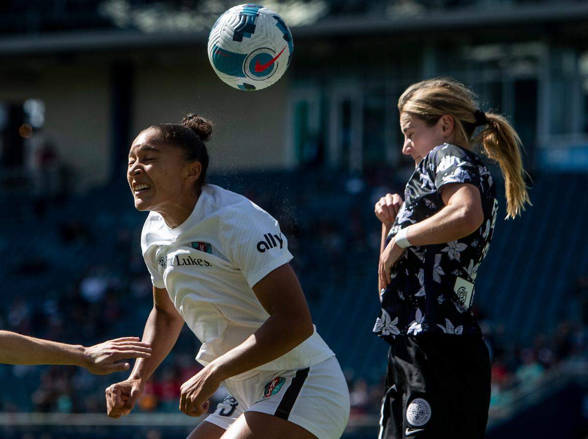 KC Current forward Elyse Bennett (23) heads the ball from a defender during the home opener between the KC Current and Racing Louisville on April 2, 2022 at Children’s Mercy Park in Kansas City, KS
