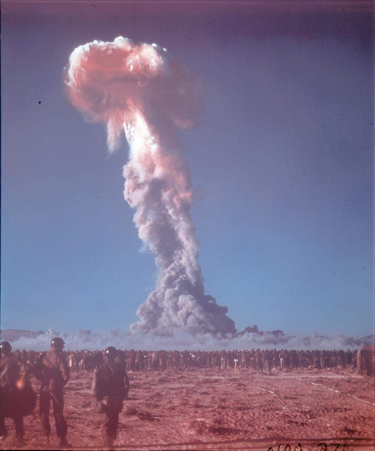 Military personnel observing an atomic explosion at the Nevada Test Site north of Las Vegas.