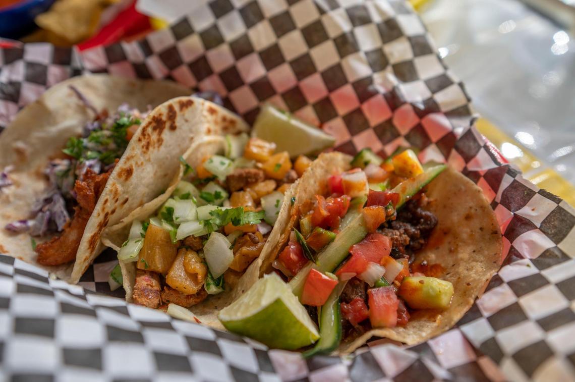 Tiki Taco serves a Thai fried chicken taco, left, abuela pastor taco, Korean beef taco and more.