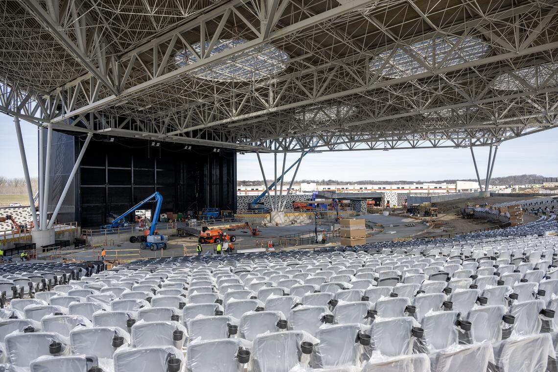 Rows of newly installed seats face the stage beneath the canopy roof during construction of the Morton Amphitheater on Friday, March 13, 2026, in Riverside.