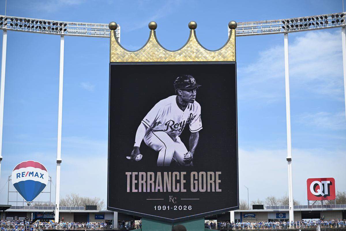 Kauffman Stadium observe a moment of silence for Terrance Gore before the home opener against the Minnesota Twins on Monday, March 30, 2026, in Kansas City.