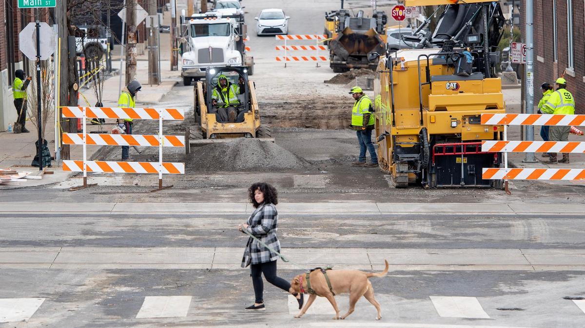 Crews repair a stretch of East 17th Street from Main to Campbell Streets on Tuesday, Jan. 3, 2023, in Kansas City. A water main broke on Friday causing significant damage to the street.