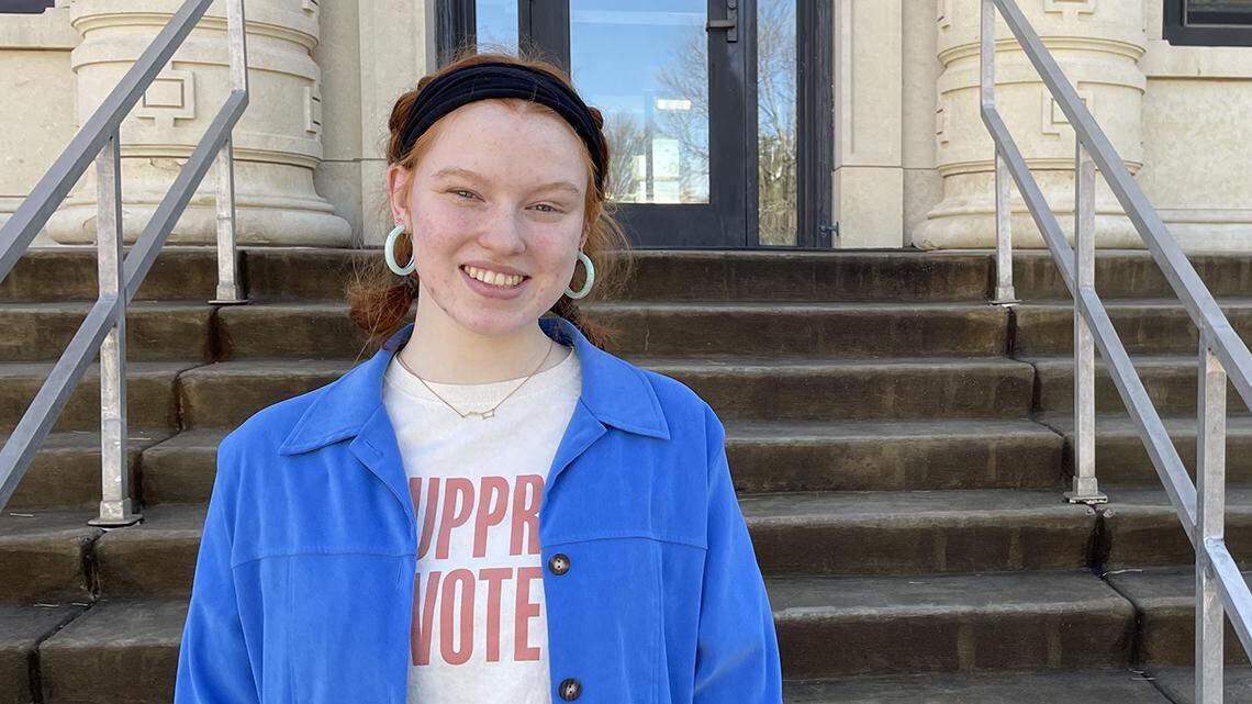 Student teacher Chloe Chaffin, in front of the education building at Washburn University, where she’s a sophomore. “It definitely worries me, what’s going on in the statehouse.”