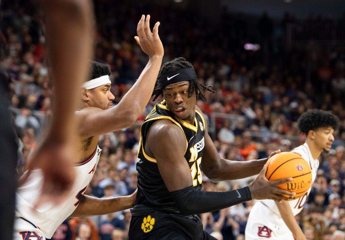 Missouri Tigers forward Mark Mitchell makes a post move on Auburn Tigers center Dylan Cardwell during a Saturday, Jan 4, 2025 men’s basketball game at Neville Arena in Auburn, Alabama.