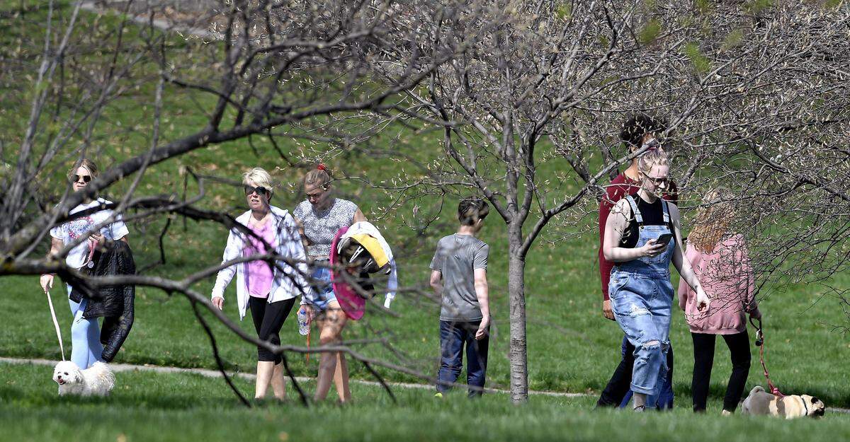 Thursday’s mild temperatures and sunshine brought out those wanting to enjoy it at Loose Park. Social distancing didn’t seem to be a concern for many who walked or jogged the paths around the park just south of the Country Club Plaza.