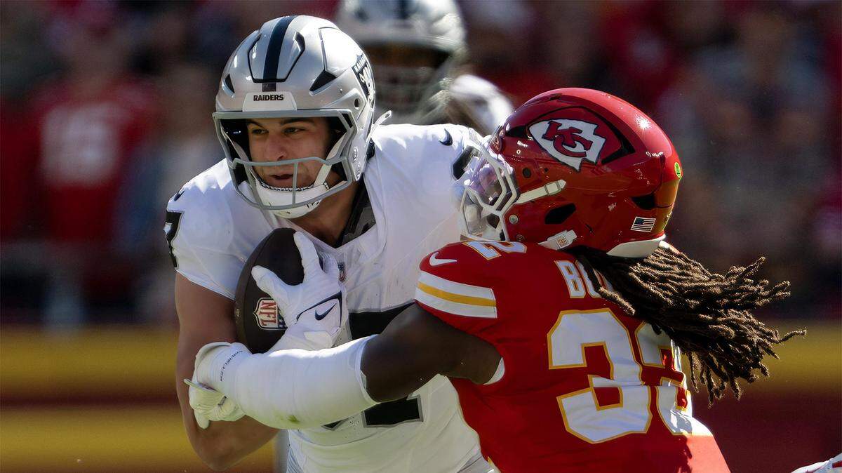 Las Vegas Raiders tight end Michael Mayer (87) is tackled by Kansas City Chiefs linebacker Nick Bolton (32) during the first half on Sunday, October 19, 2025, at GEHA Field at Arrowhead Stadium in Kansas City.