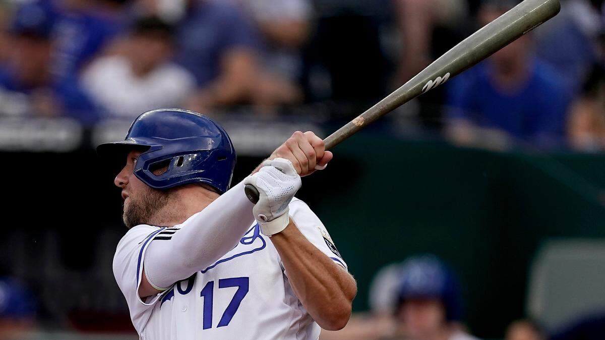 Kansas City Royals’ Hunter Dozier hits an RBI single during the first inning of a game against the San Diego Padres on Aug. 27, 2022, in Kansas City, Mo.