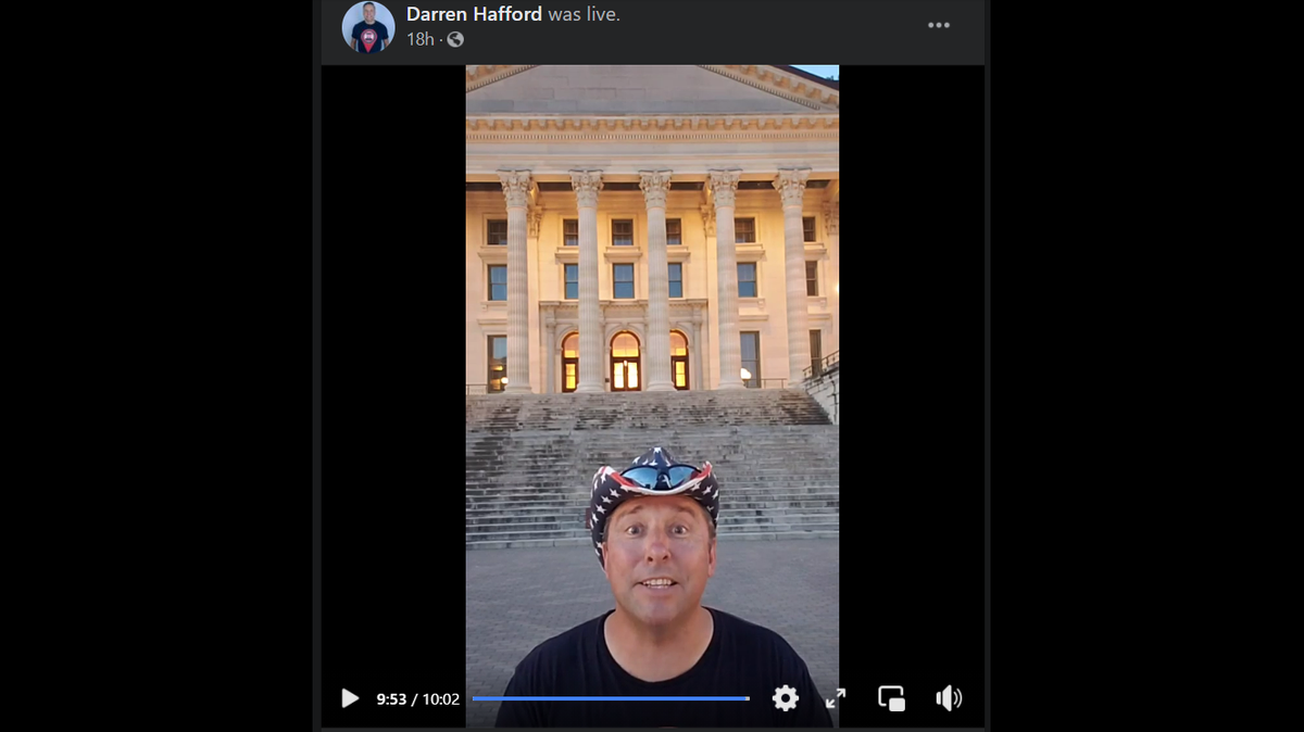 Darren Hafford in front of the Kansas State Capitol, where he was about to do 50 push ups to raise awareness of veteran suicide. This was the 47th state capitol on his tour.