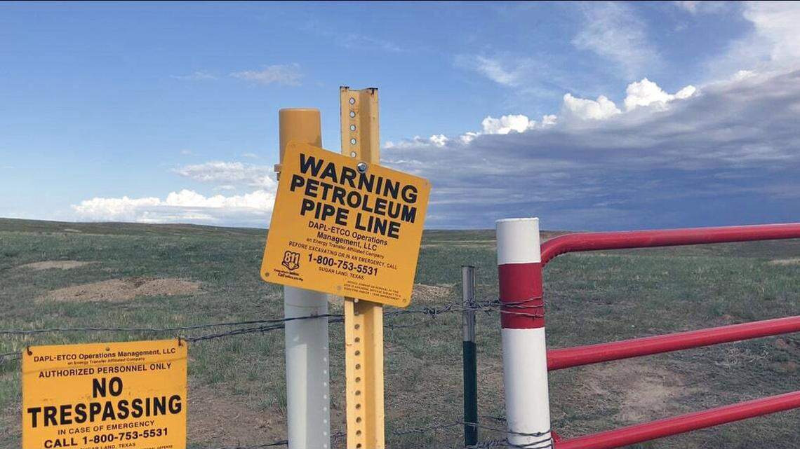 FILE - In this May 20, 2021, file photo, signs marking the Dakota Access Pipeline are posted north of Cannonball, N.D. and the Standing Rock Reservation. Two women were sentenced after they admitted to damaging parts of the pipeline in Iowa, officials say.