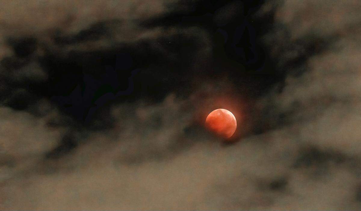 Former Kansas City Star photographer John Sleezer captured the total eclipse of the moon in the early morning hours of Tuesday, November 8, 2022 in Olathe, Kan. The next total lunar eclipse won’t be visible in this area until March 2025.