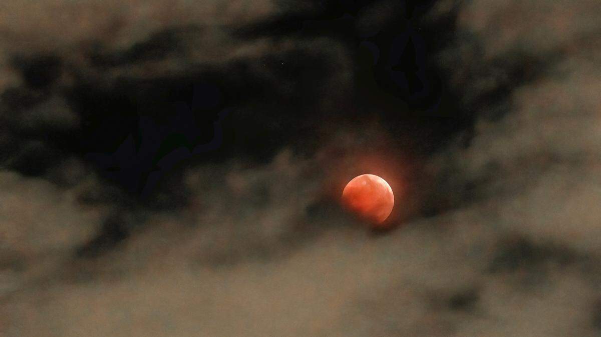 Former Kansas City Star photographer John Sleezer captured the total eclipse of the moon in the early morning hours of Tuesday, November 8, 2022 in Olathe, Kan. The next total lunar eclipse won’t be visible in this area until March 2025.