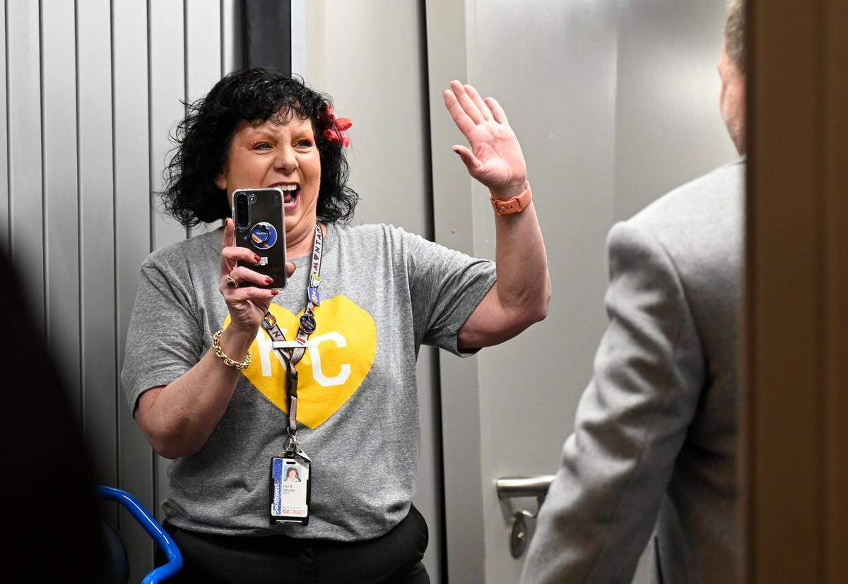 LIsa DeLano, an agent for Southwest Airlines greeted the first travelers boarding a 5 a.m. flight to Chicago, the first flight departing from the new $1.5 billion single terminal at Kansas City International Airport on Tuesday, Feb. 28, 2023.