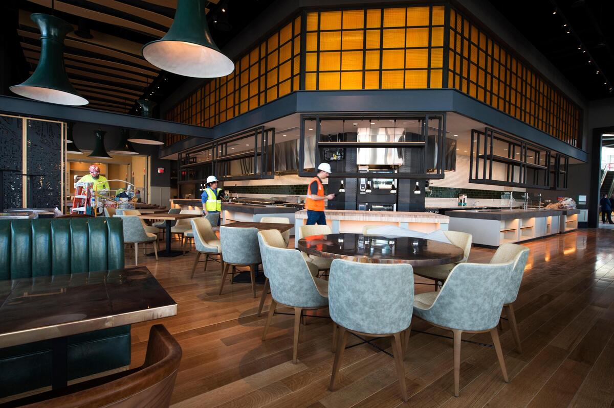 Workers hustled Wednesday as they passed through the new Loews Kansas City Hotel’s 300-seat restaurant. 