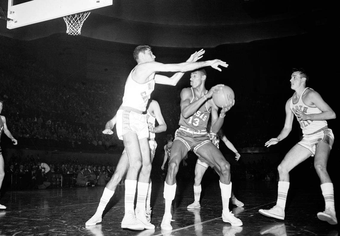 North Carolina All-American Lennie Rosenbluth (left) defends KU Jayhawks All-American Wilt Chamberlain during the 1957 NCAA national championship game for men’s college basketball at Kansas City’s Municipal Auditorium. UNC won 54-51 in triple-overtime.