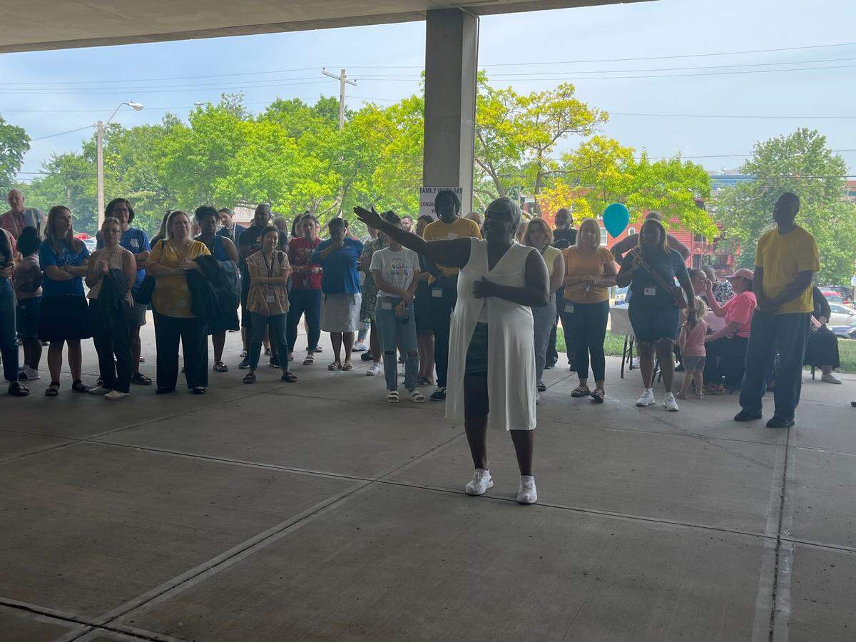Pauline Green talks to a crowd of court officials and other families who regained custody of their children and celebrated at the Jackson County Family Court’s Family Unity Day Thursday.