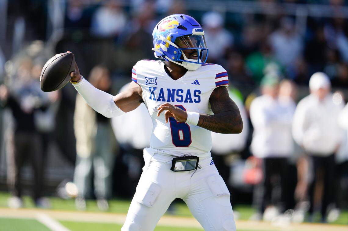 Kansas Jayhawks quarterback Jalon Daniels (6) drops back to pass against the Baylor Bears during the second half at McLane Stadium on Nov. 30, 2024.