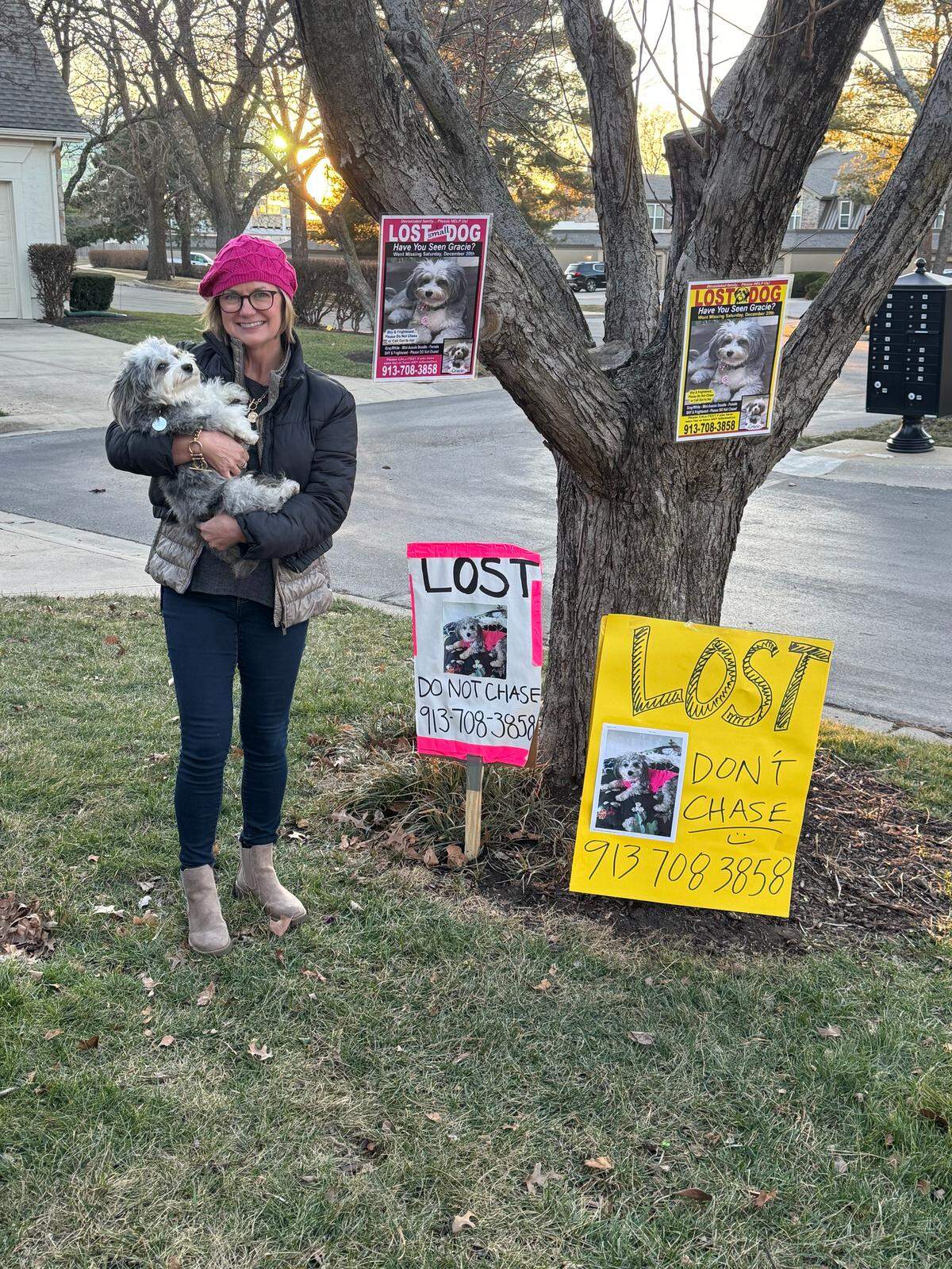Julie Hirons with Gracie and just some of the many posters family and friends posted around Leawood.