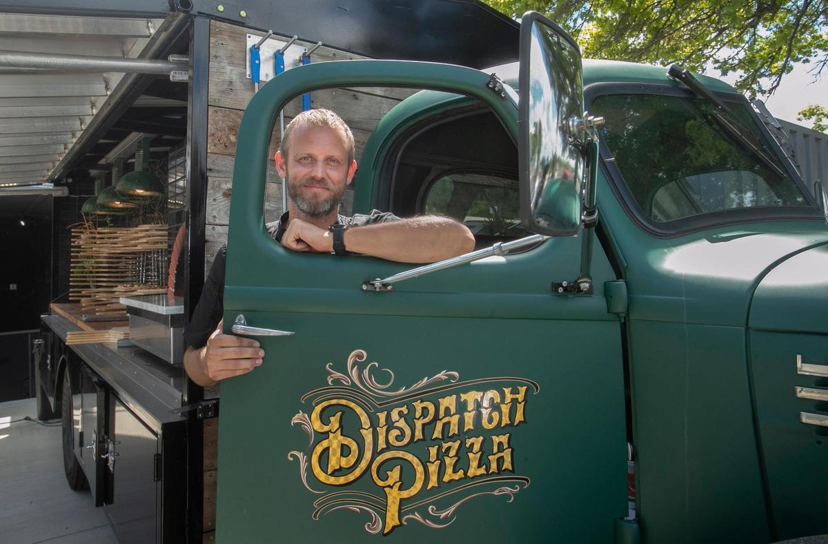 Dispatch Pizza owner Jeremy Long in the cab of his 1949 International Harvester.