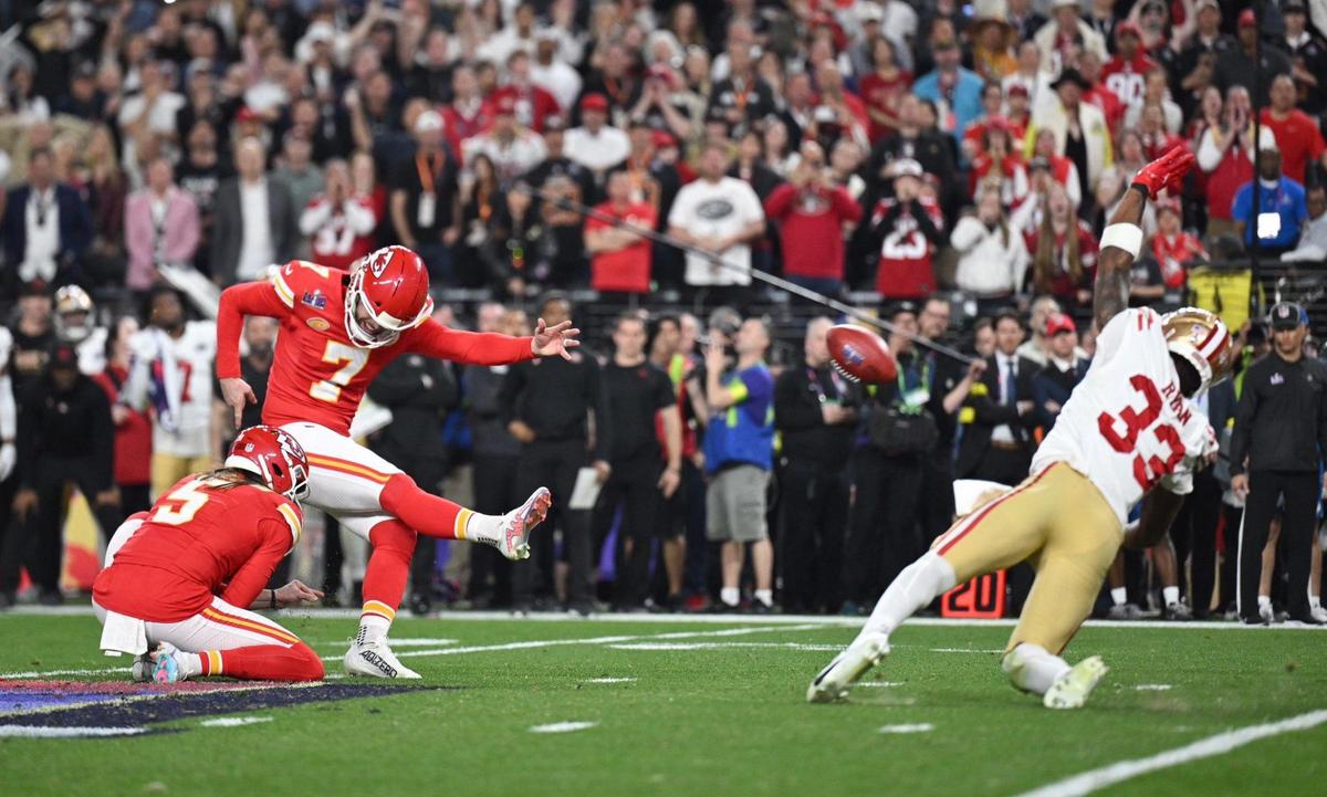 The game-tying field goal kicked by Kansas City Chiefs place kicker Harrison Butker (7) that sends the game into overtime is nearly blocked by San Francisco 49ers safety Logan Ryan (33) in the final seconds of regulation in Super Bowl LVIII, Sunday, Feb. 11, 2024, in Las Vegas.