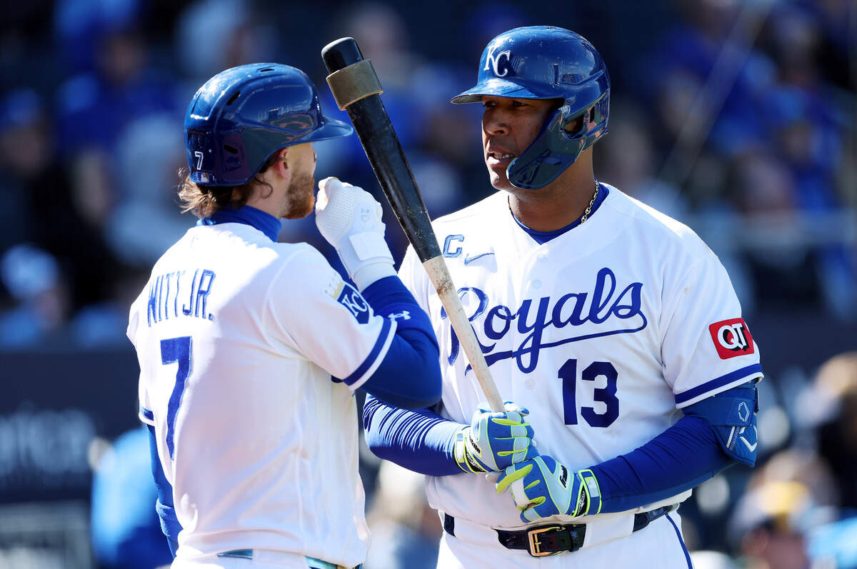 Royals shortstop Bobby Witt Jr., left, talks strategy with catcher Salvador Perez during a game against the Milwaukee Brewers at Kauffman Stadium in Kansas City on April 4, 2026.