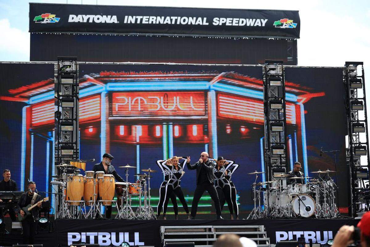 DAYTONA BEACH, FLORIDA - FEBRUARY 16: Pitbull performs onstage during pre-race ceremonies prior to the NASCAR Cup Series Daytona 500 at Daytona International Speedway on February 16, 2025 in Daytona Beach, Florida. (Photo by Mike Ehrmann/Getty Images)