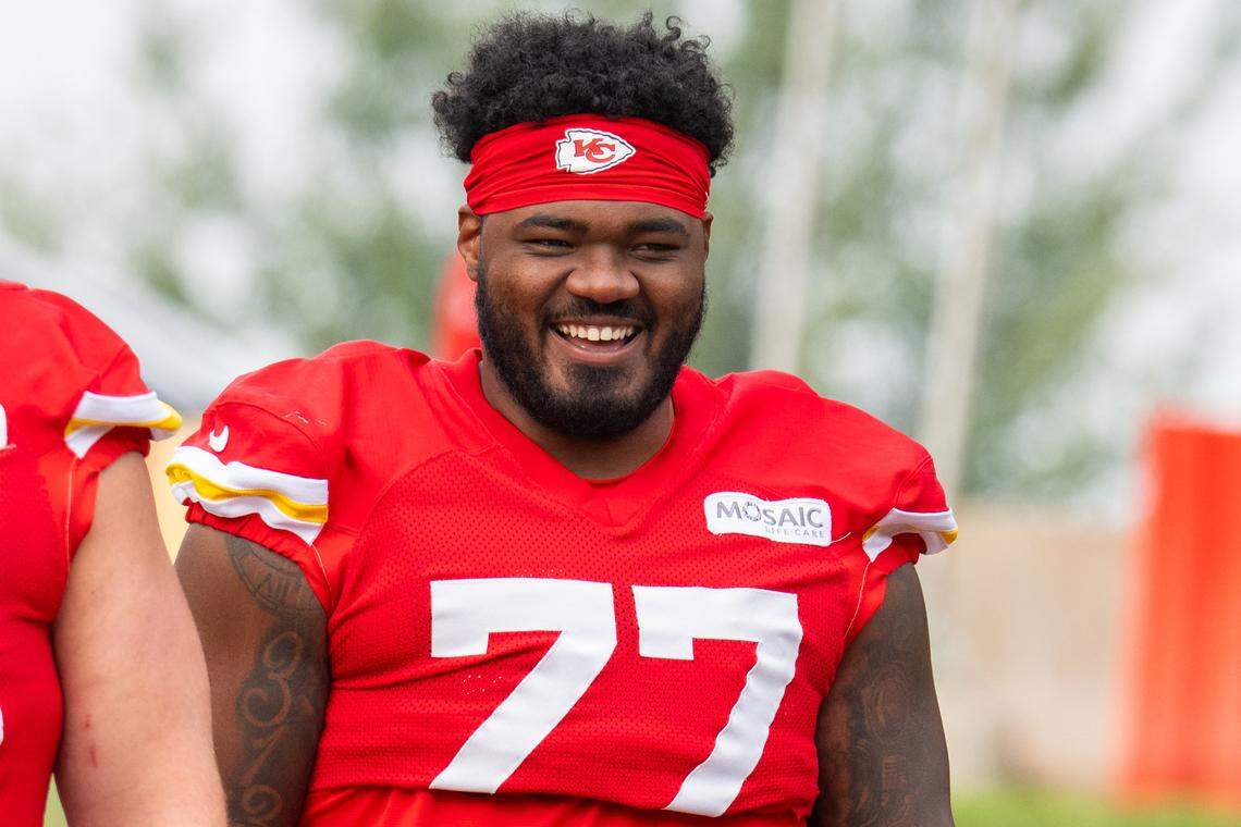 Kansas City Chiefs offensive lineman Jaylon Moore smiles as he walks toward the Missouri Western State University practice field for training camp on Aug. 3, 2025 in St. Joseph, Mo.
