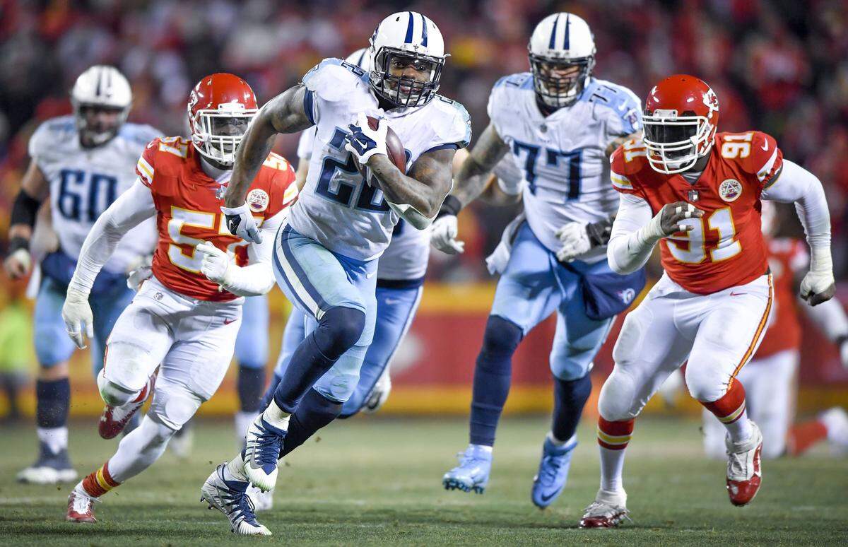 Tennessee Titans’ Derrick Henry (22) runs 35 yards for a touchdown in the fourth quarter as Kansas City Chiefs linebacker Kevin Pierre-Louis (57) and Tamba Hali (91) tried to catch him during the Kansas City Chiefs and Tennessee Titans football game at Arrowhead Stadium on Saturday, January 6, 2018, in Kansas City, Missouri.