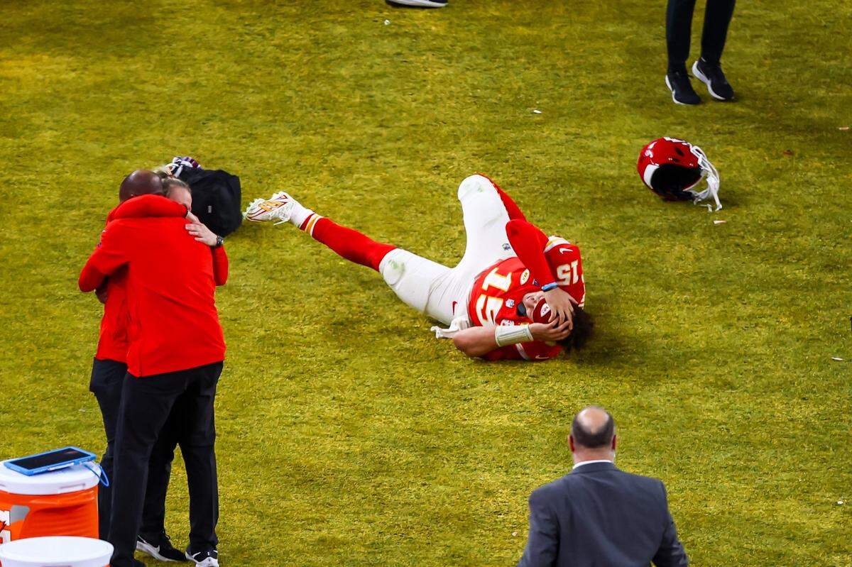 Kansas City Chiefs quarterback Patrick Mahomes (15) collapses in joy after defeating the San Francisco 49ers during Super Bowl LVIII, Sunday, Feb. 11, 2024, in Las Vegas.