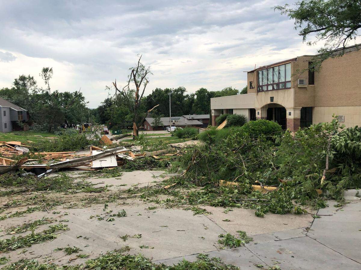 The Kappa Alpha Theta (pictured above) and Chi Omega houses east of the Kansas State University campus were two of five buildings authorities declared condemned and unsafe to occupy Saturday evening after storms tracked through Manhattan, Kansas. Both sorority houses were unoccupied. Three single-family homes in the neighborhood on McClain Lane were also severely damaged.