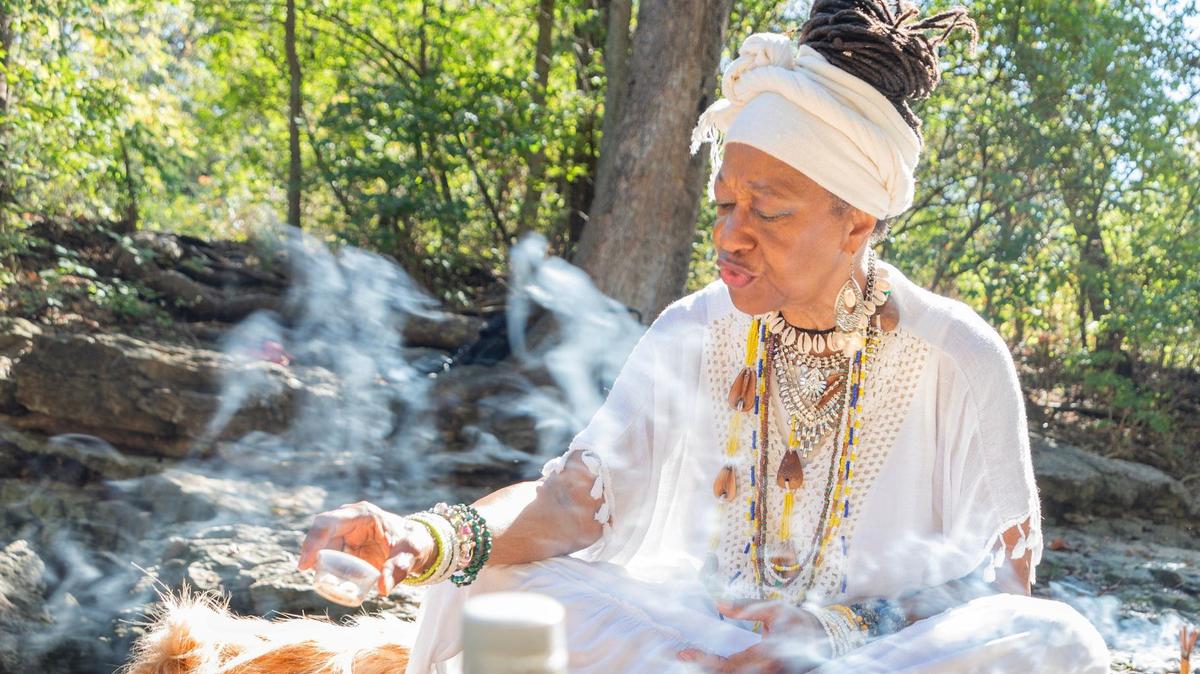 Elder Toni Runnels, an ordained Ifa priestess and holistic therapist for 24 years, leads a traditional ceremony with fellow follwers of Ifa.