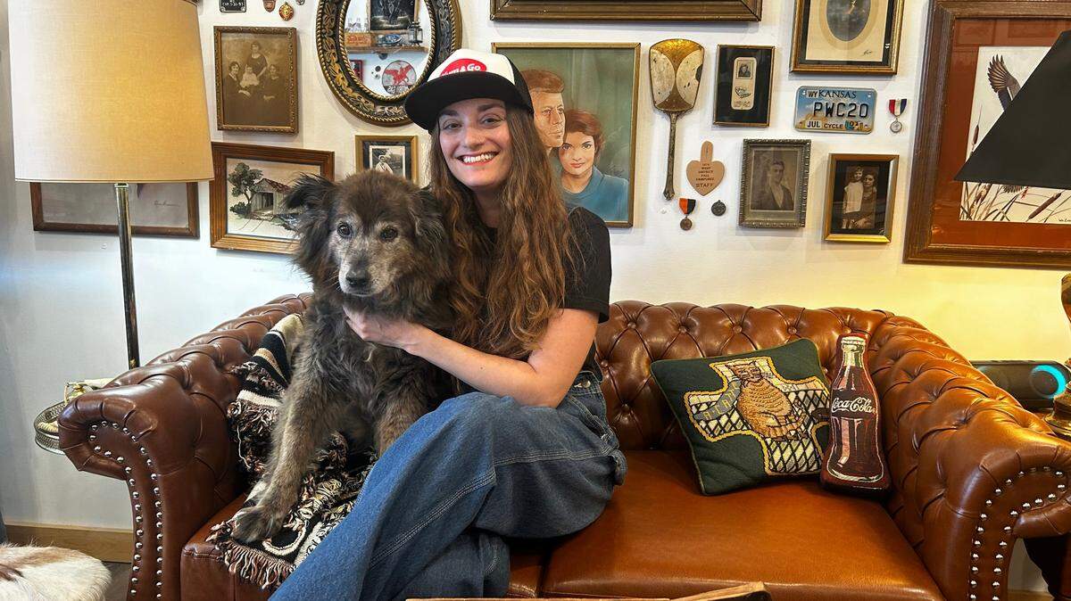 Owner Lindsey Kupper with shop dog Maddie at Gilded Chaos, now open at 314 Westport Road.