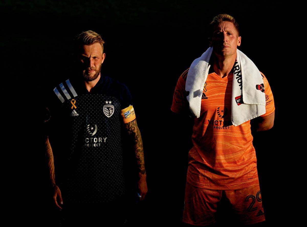 Sporting Kansas City forward Johnny Russell (7) and goalkeeper Tim Melia (29) before the match against the Seattle Sounders at Children’s Mercy Park on Sept. 26, 2021.