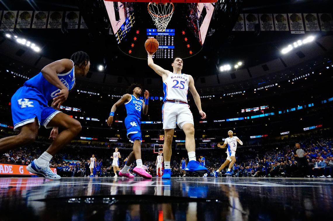 Kansas’ Nick Timberlake grabs a rebound during Tuesday night’s Champions Classic game against the Kentucky Wildcats at Chicago’s United Center.